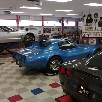 Classic Corvettes, Car Lift, and Wall Decor in Garage - Norm
