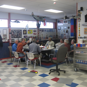 Garage Lounge with Car Memorabilia and Trophies - Norm