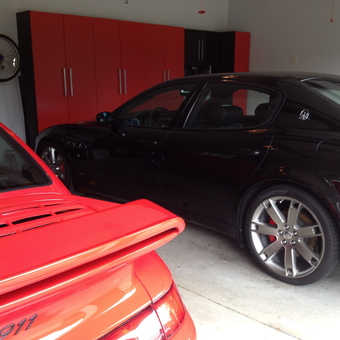 Garage with Red Cabinets, Luxury Cars, and Wall Bike - Joel from Mcmurray, PA
