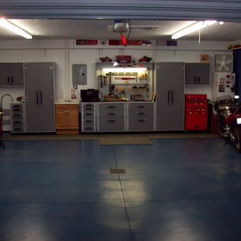 Organized garage with cabinets, tool chests, and motorcycle - 1961 Healey Mark I 3000 & a Half from Rittman, OH