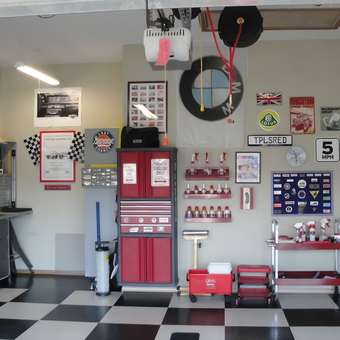 Organized garage with tool chest, wall art, and storage - Topless Red from Spanaway, WA