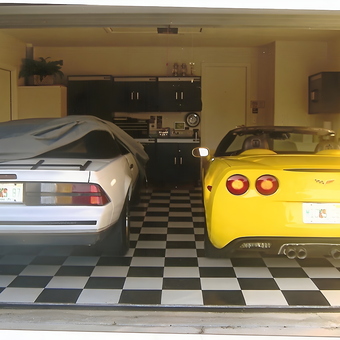Garage with Checkered Floor, Cabinets, and Two Sports Cars - Mick from Bradenton, FL