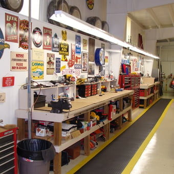 Organized garage workspace with tool chests and wall signs - Tony from Palatka, FL