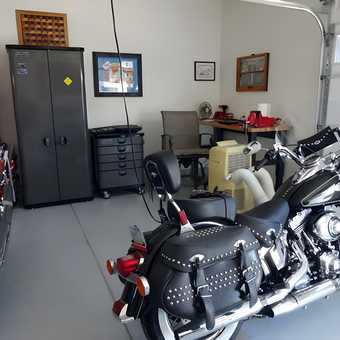 Organized garage with motorcycle, tool cabinets, and workspace - mahali from Phoenix, AZ
