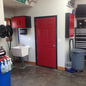 Organized garage with red cabinets and tool chests - Murph from Morehead, KY