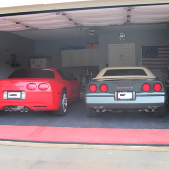 Two Corvettes and Motorcycles in Flag Decor Garage - HogChef from Mobile, AL