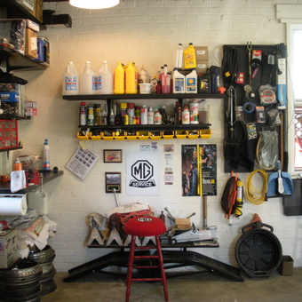 Organized garage with tools, shelves, and MG decor - dbd74mgb from Frederick, MD