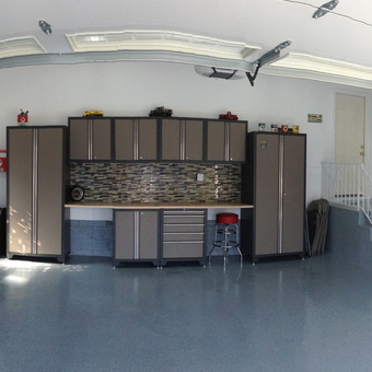 Organized garage with cabinets, tool chest, and vintage signs - Richard from Fairfield, NJ
