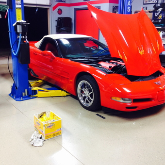 Red Corvette On Atlas Lift With Tools - mmanship from Bowling Green, Ky, KY