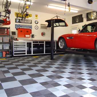 Organized garage with car lift and cabinets - David from Plymouth, MA