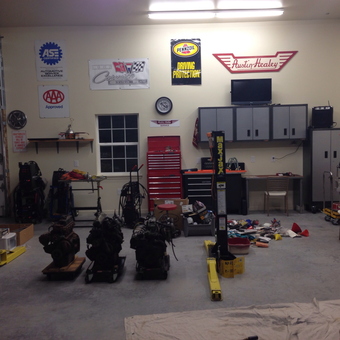 Organized garage with MaxJax lift, tool cabinets, and workbench - Fred from Tulsa, OK