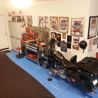 Organized Garage With Motorcycle, Tool Storage, and Wall Decor - baebra from Goodyear, AZ