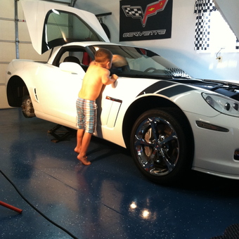 White Corvette in Clean Garage with Corvette Decor - Generations from Corbin, KY