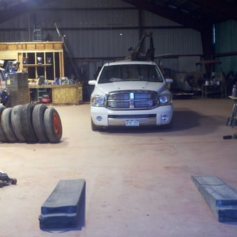 Organized garage with tools, tires, ramps, and truck - Salty Box Racing from Glenwood Springs, CO