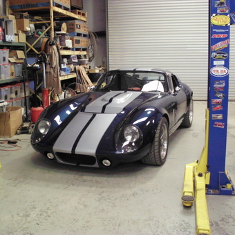 Classic sports car in organized garage with car lift - John from Livermore, CA