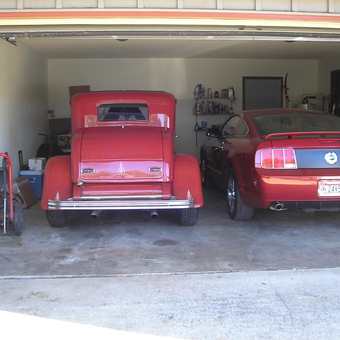 Classic and Modern Red Cars in Organized Garage - DW from Huntsville, AL