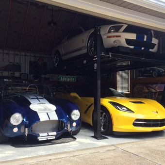 Classic and Modern Cars with Car Lift in Garage - Trouble