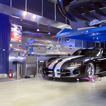 Modern garage with car lift and tool storage - TooBlue Racing