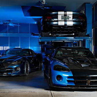 Luxury Blue Sports Cars and Car Lift in Modern Garage - TooBlue Racing