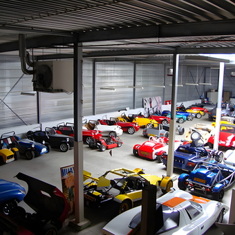 Spacious Garage Filled With Kit Cars and Sports Cars - Anonymous