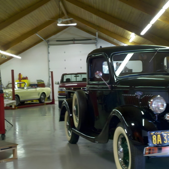 Classic Car Garage with Lifts and Vintage Vehicles - ML