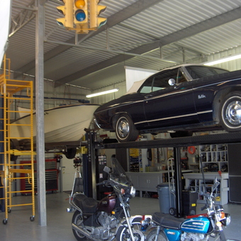 Garage with Car Lift, Motorcycles, and Tools - The Mintle Barn from Fallbrook, CA