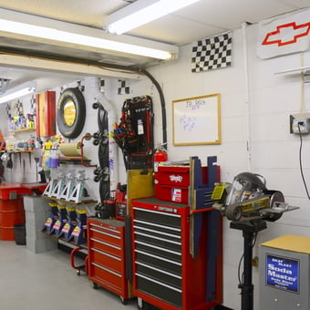 Organized garage with tool chests, jack stands, and wall racks - Rick from Hurricane, WV