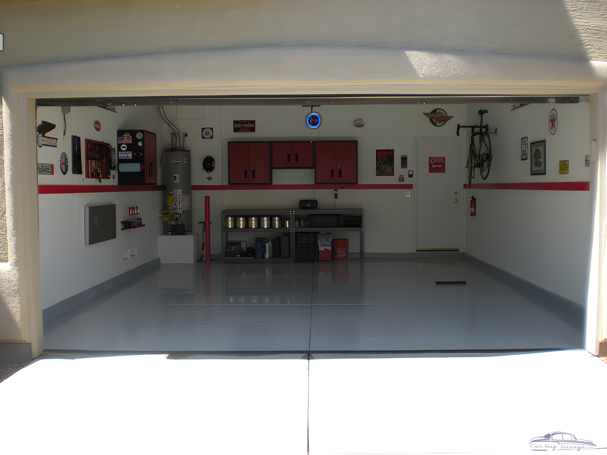 Organized garage with red cabinets and wall decor - Jim from Las Vegas, NV