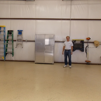 Organized garage with ladders, cabinets, and tools - Jim from Caldwell, TX