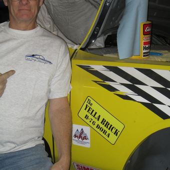 Yellow race car with decals and garage apparel - the YELLA BRICK from Emmett, ID