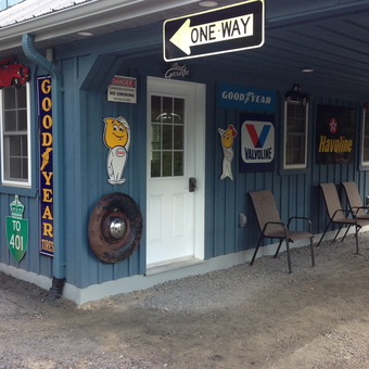 Garage Decor with Vintage Signs and Chairs - Goldstien from Hollywood, FL