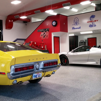 Luxury garage with car lift, classic cars, and wall art - Rbwiii from Bakersfield, CA
