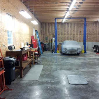 Spacious garage with car lift, workbench, and tool storage - Scott from Kansas City, MO