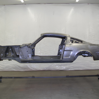 Classic car body on rotisserie in garage - Reds from Kirkland, WA
