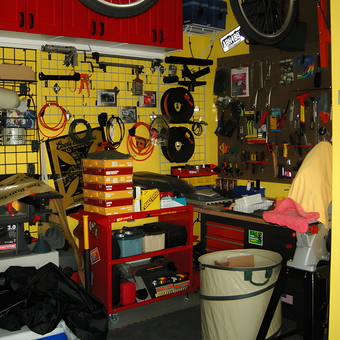 Organized garage with wall storage, tool cart, and cabinets - Everett from San Jose, CA