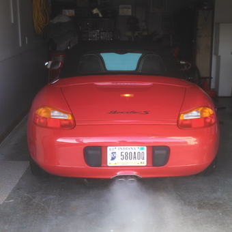 Red Porsche Boxster S in organized garage - john from fort wayne, IN