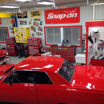 Organized garage with red tool chests and classic cars - Ron from Utica, IL