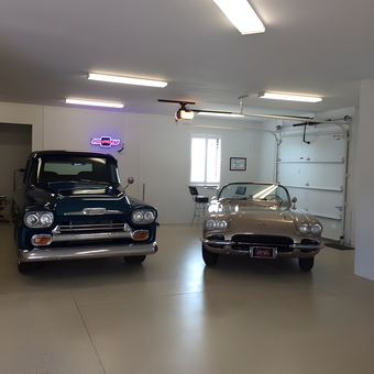 Classic Cars in Clean Garage with Neon Sign - Severely Twisted from Nokomis, FL