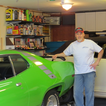 Organized garage with classic cars and storage cabinets - CJ from Minot, ND
