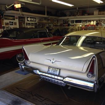Classic Car Garage with Fluorescent Lighting and Wall Decor - Lighting