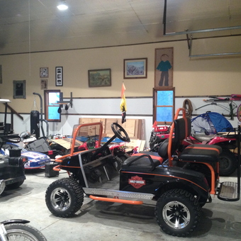 Organized garage with ATVs, golf carts, and tools - Doc Steve from Kansas City, KS