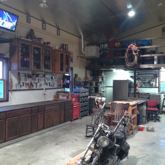 Organized garage with storage, workbenches, and motorcycle - Doc Steve from Kansas City, KS