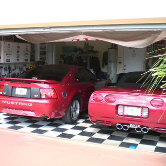 Red Mustang and Corvette in Checkered Floor Garage - Alex from Miami, FL