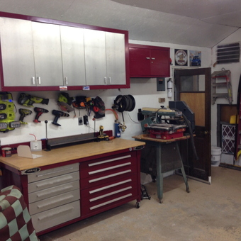 Organized garage with cabinets, workbench, and ladders - Jim from Blue Springs, MO