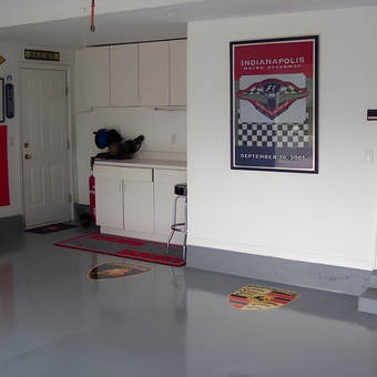 Organized garage with cabinets, wall art, and logo mats - Larry from Layton, UT