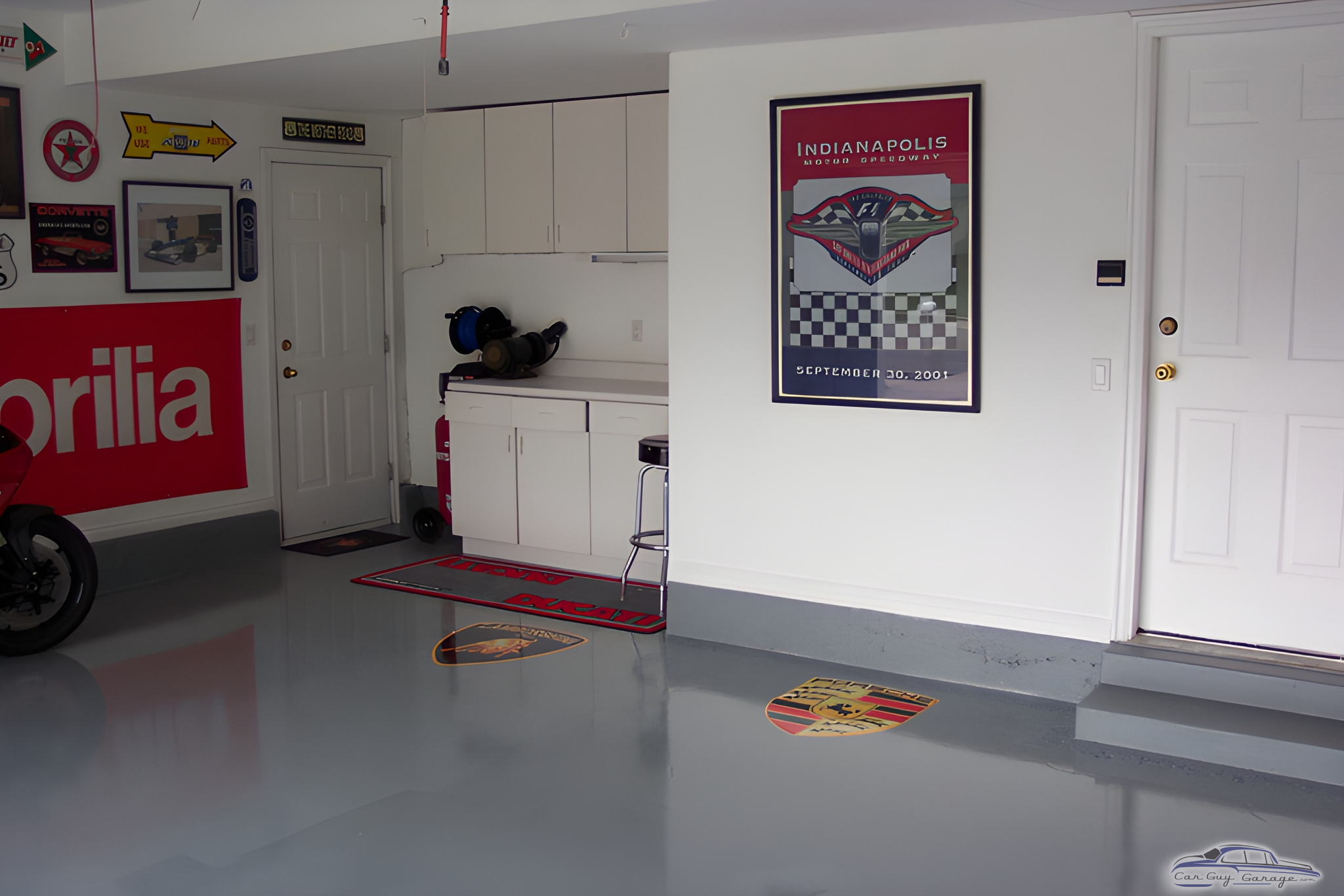 Organized garage with cabinets, wall art, and logo mats - Larry from Layton, UT