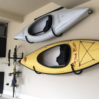 Garage With Kayak Wall Racks, Bike Mount, And Storage Cabinets - Anonymous