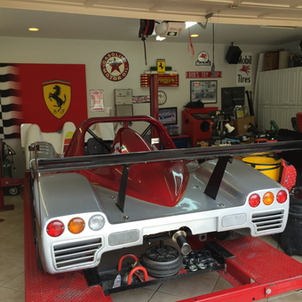 Exotic race car on lift with Ferrari decor - The Godfather from Camarillo