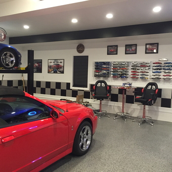 Custom garage with car lift, display cases, and bar stools - LBC from Mount Airy, MD