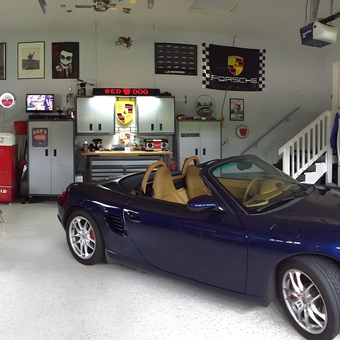 Organized garage with Porsche, bar stools, and cabinets - Monti Mike from Monticello, MN